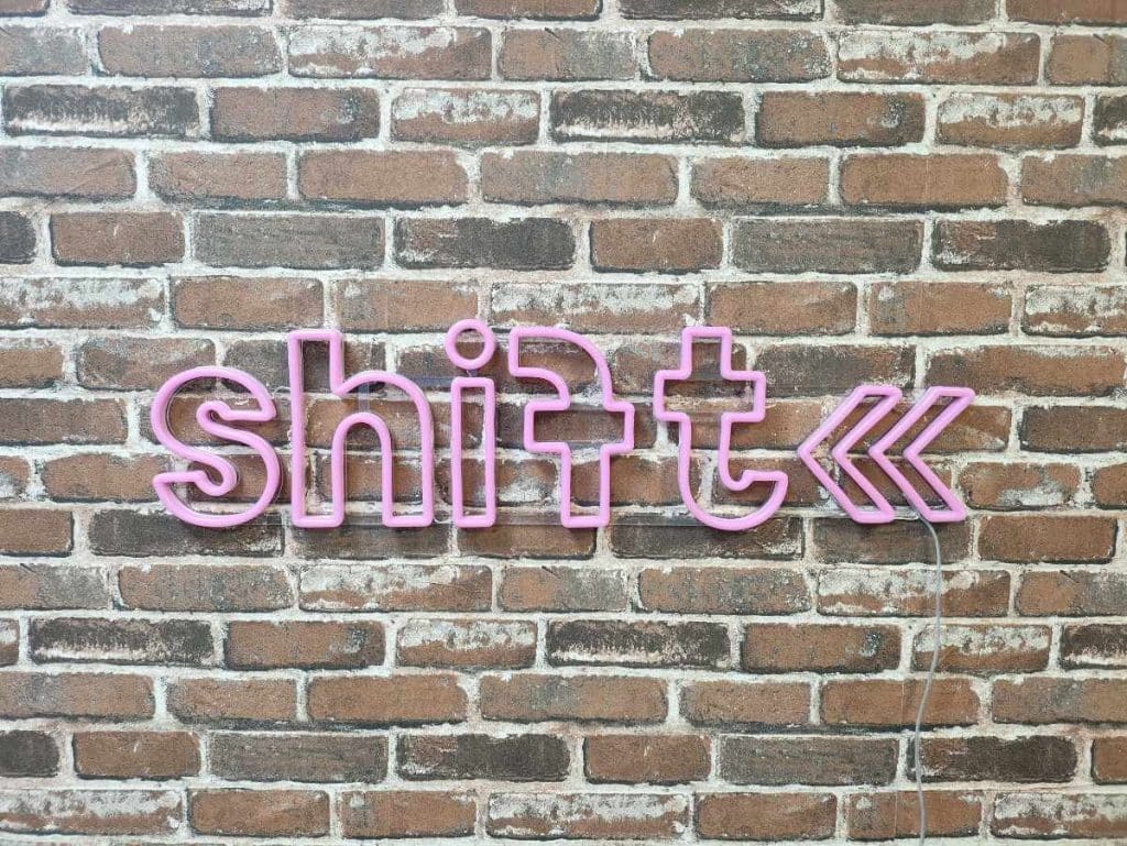 Shift neon sign - placed on a wall